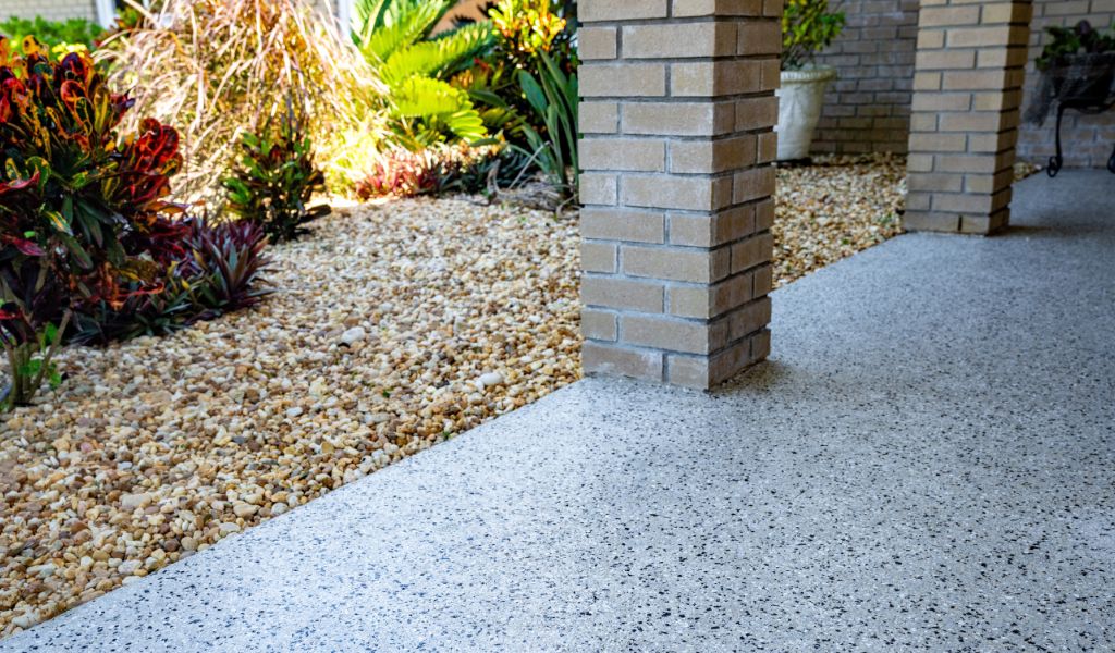 Home patio with BCE concrete coating floors, featuring a smooth, attractive surface that enhances the outdoor space's aesthetics and durability.