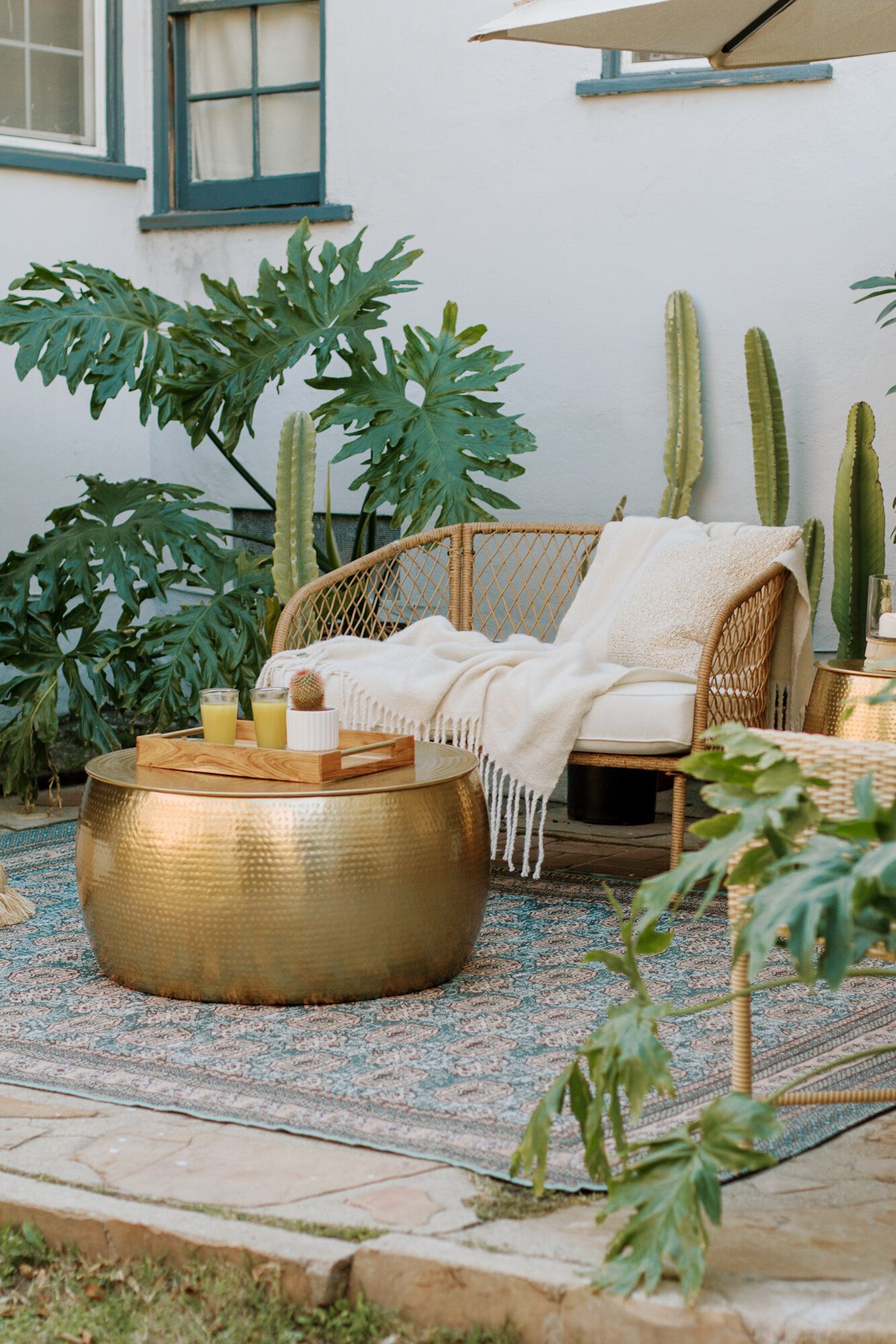 patio with outdoor rug and plants