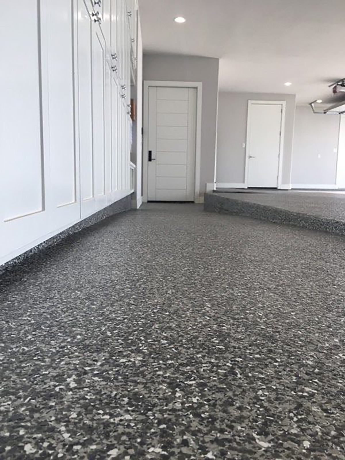 Concrete Floor Basement coating with grey and white polyurea flakes